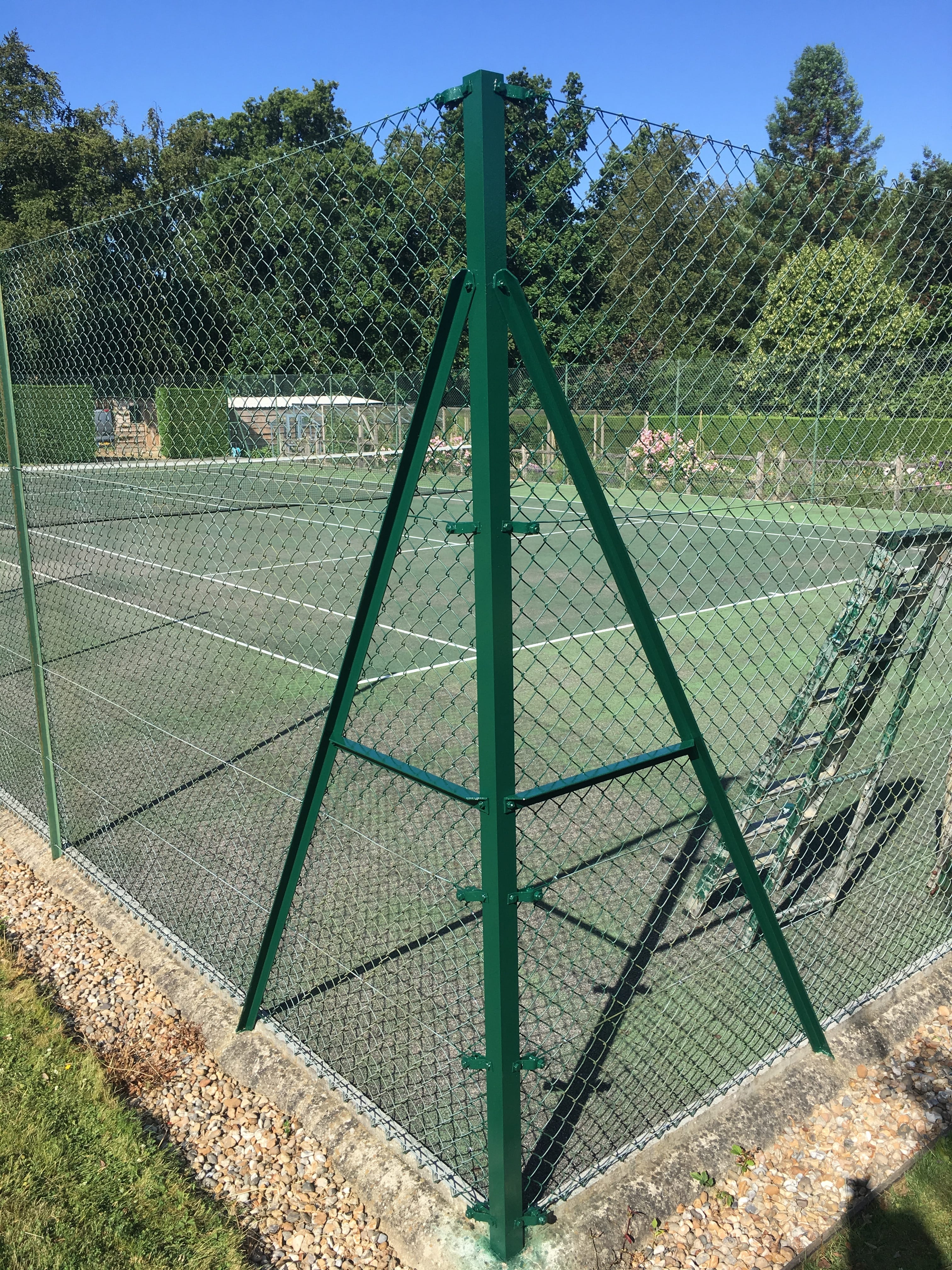 sunny tennis court infront of building