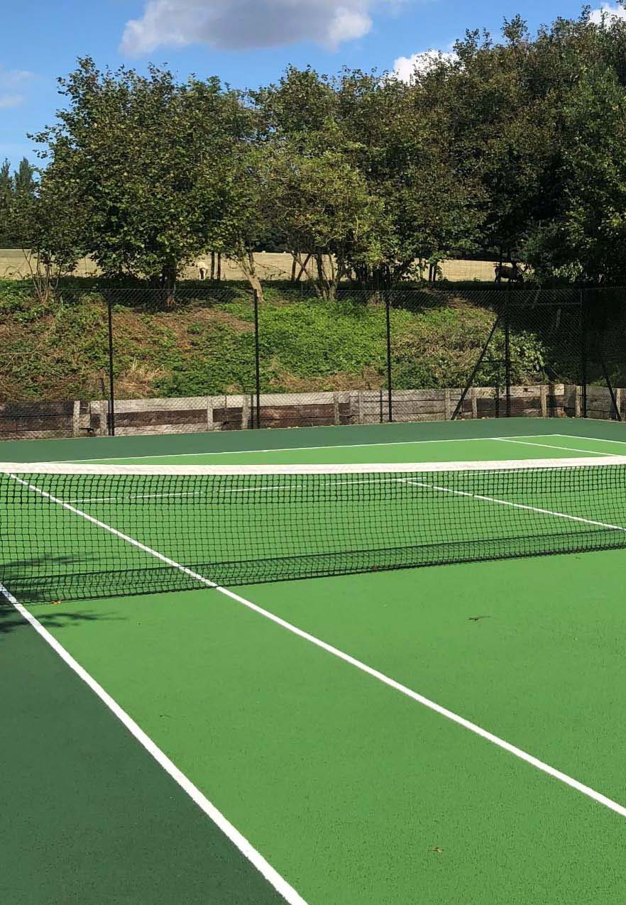 Green Tennis Court on a nice sunny day